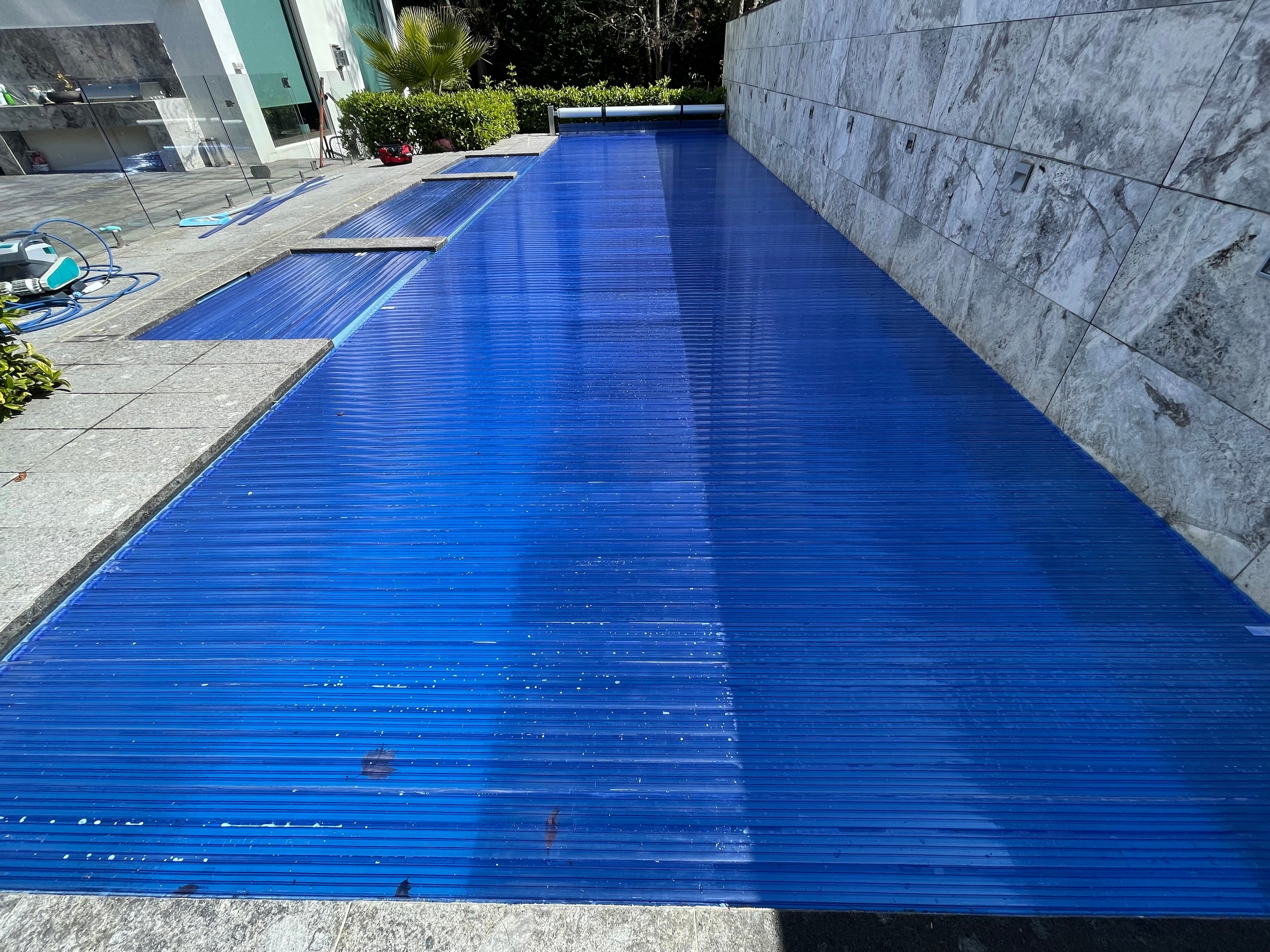Premium PoolDeck slatted pool cover on a luxury South African home