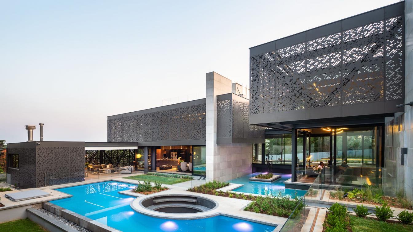 Pool cover installation in Johannesburg with city skyline